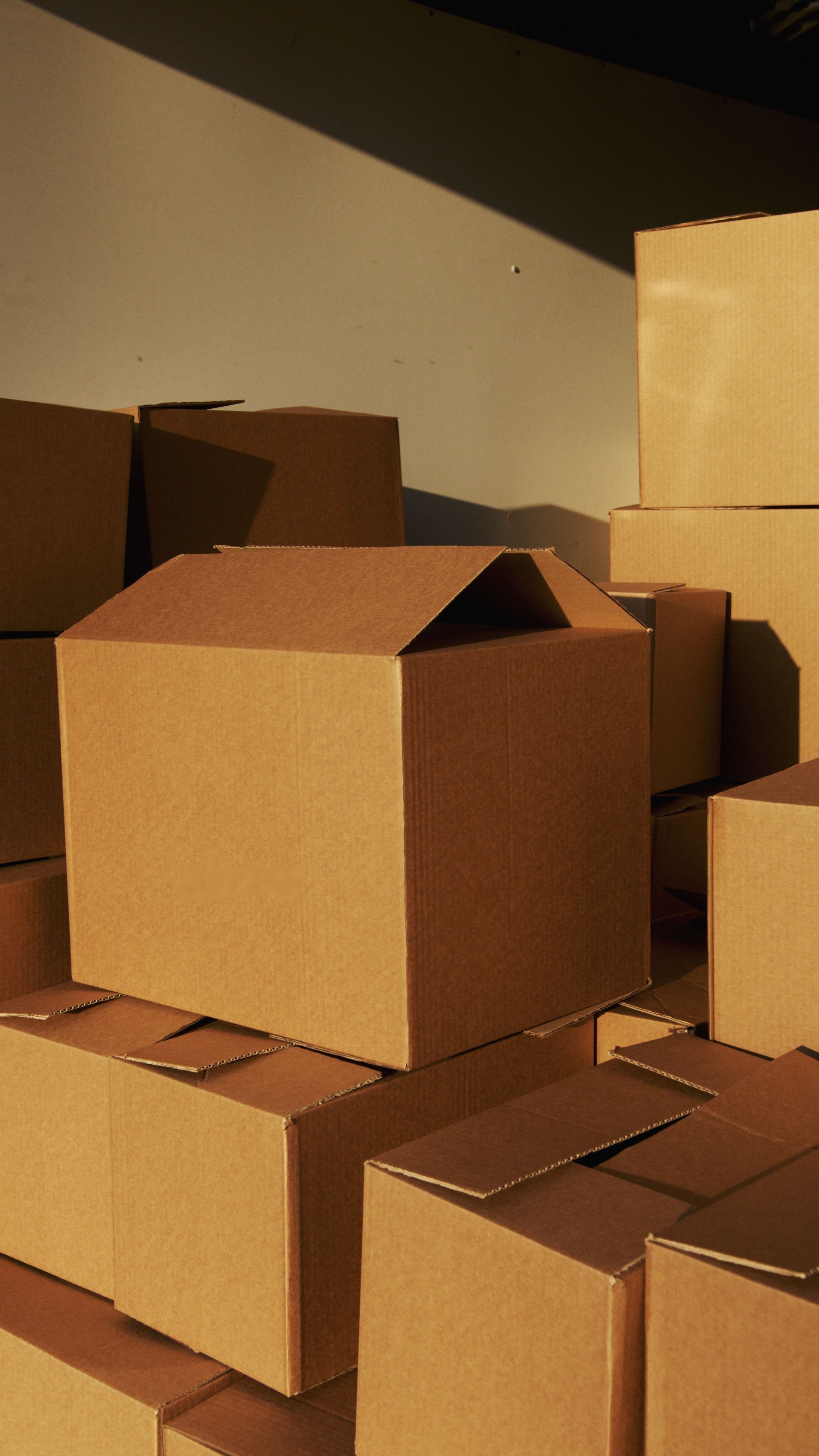 Stacked corrugated shipping boxes with visible fluted board