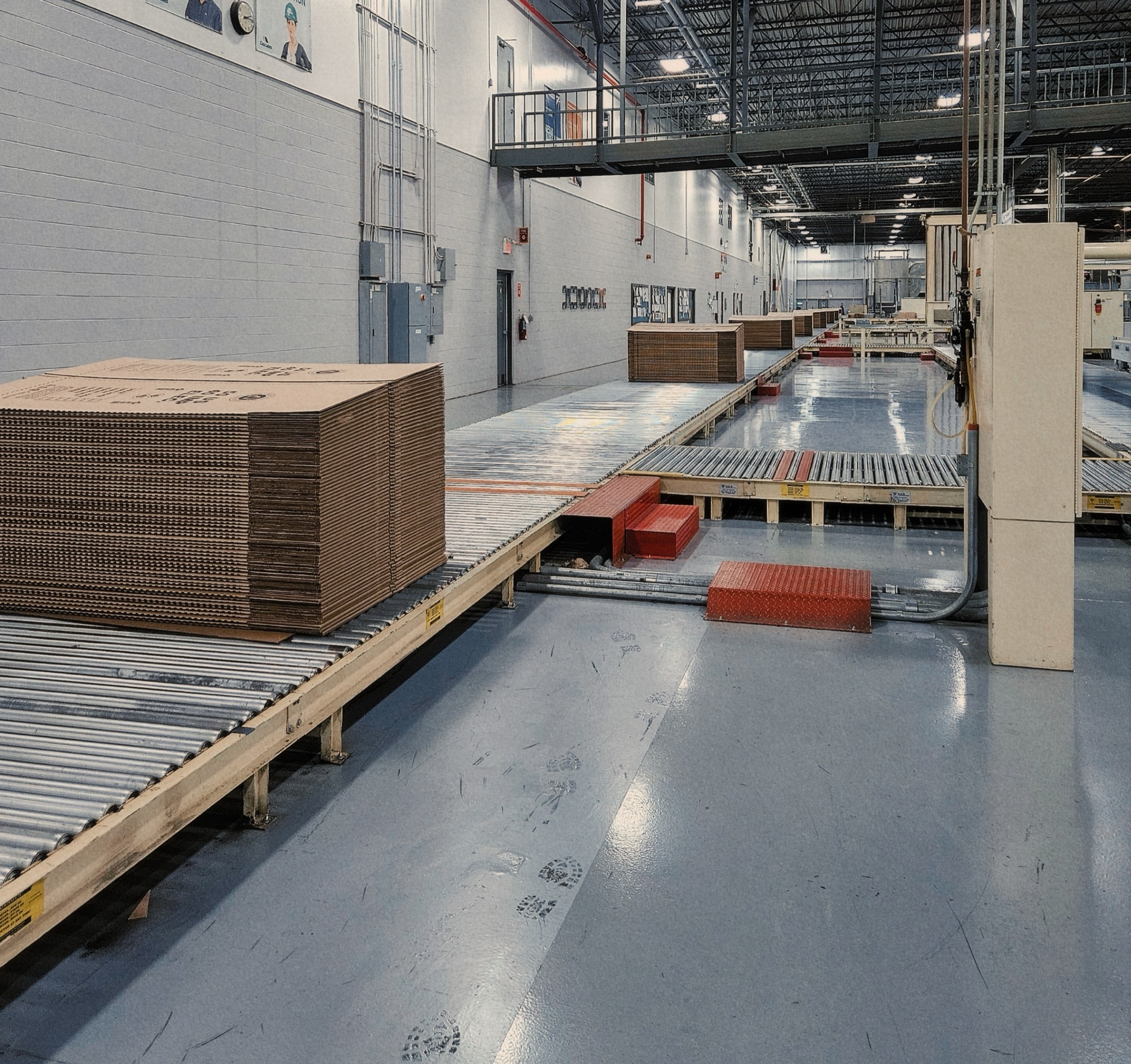 Corrugated packaging moving through production equipment