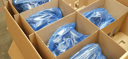 Industrial components held in a divided corrugated shipping case
