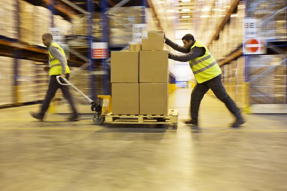 Distribution operation moving stacked shipping cartons
